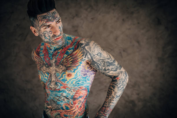 istock One young man with whole body covered in tattoos 1254761430
