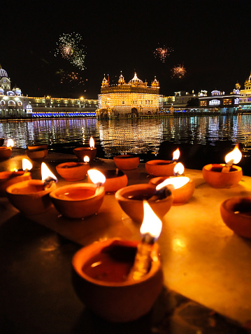 Golden Temple Amritsar lit by Diya and fire crackers Guru Purab festival and Diwali