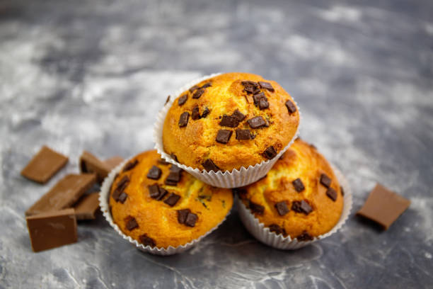 istock Homemade Chocolate Chip Muffins  on rustic background 1254762434