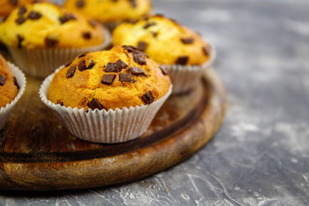 istock Homemade Chocolate Chip Muffins  on rustic background 1254762443
