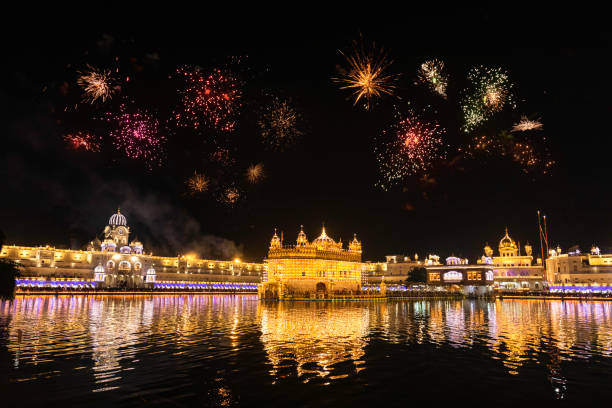 Golden Temple Amritsar Golden Temple Amritsar lit by Diya and fire crackers Guru Purab festival and Diwali diwali photos stock pictures, royalty-free photos & images