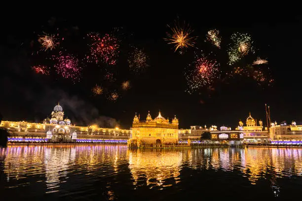 Golden Temple Amritsar lit by Diya and fire crackers Guru Purab festival and Diwali