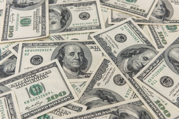 istock 100 one hundred us dollar banknotes as seamless texture and background for design 1254763692