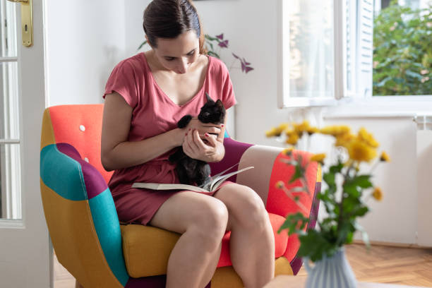 istock Woman with black kitten 1254763973