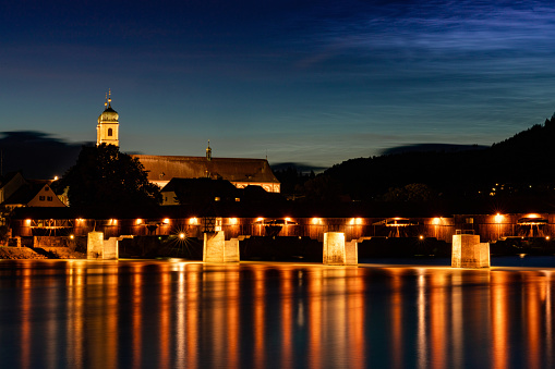 Bad Saeckingen, BW / Germany - 4 July 2020:  view of the St. Fridolin cathedral and Rhine bridge in Bad Saeckingen at night