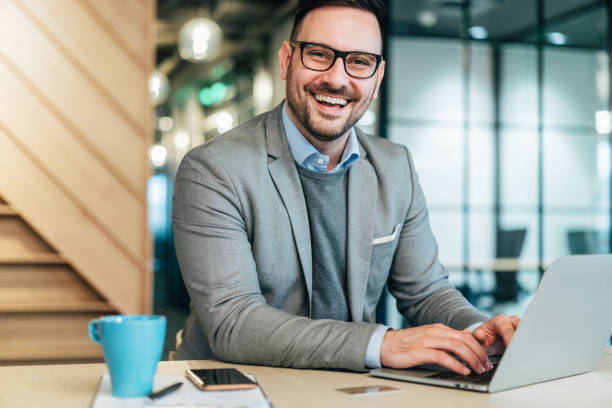 istock Young businessman working at office 1254766740