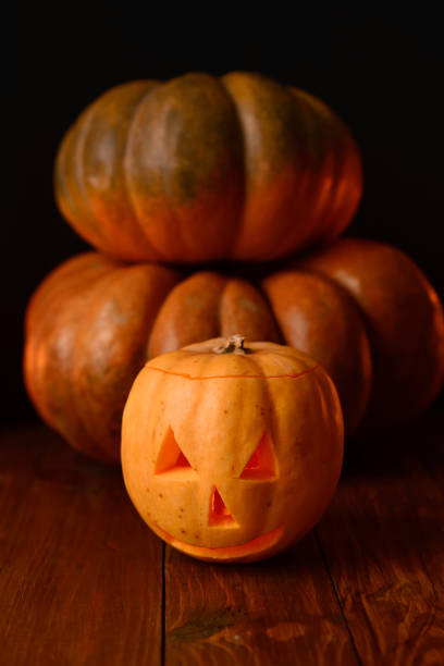 istock Halloween pumpkin on a black background. 1254768794