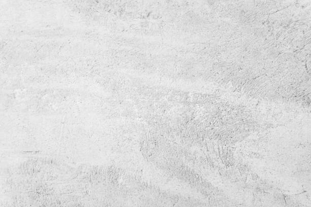 istock White concrete wall for interior or outdoor exposed surface polished. Cement have sand and stone of tone vintage, Grey natural concrete loft patterns old antique, design work floor texture background. 1254773951