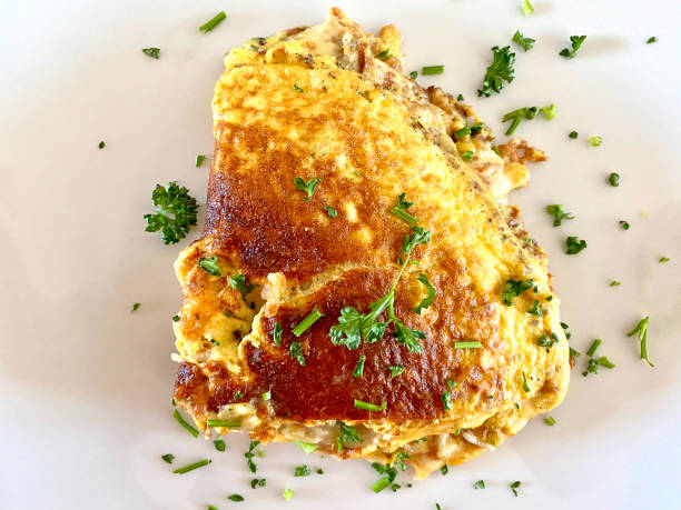 istock Deluxe cheese omelette sprinkled with parsley 1254775510