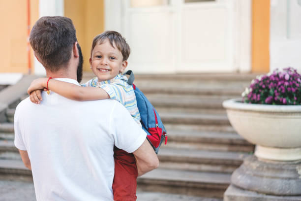 istock Father and son in the schoolyard 1254776026