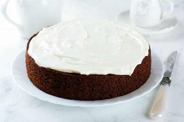 istock Carrot cake with cream on light background. Selective focus. 1254777519