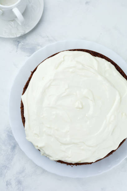istock Carrot cake with cream on light background. Selective focus.Top view. Place for text. 1254777592