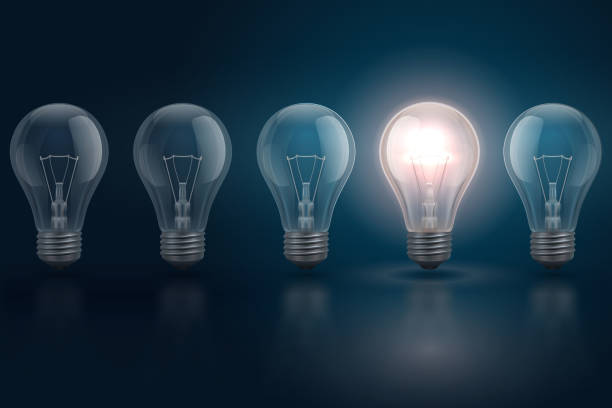istock Creative idea concept with light bulbs and one of them is glowing. Leadership, individuality, opportunities business vector background 1254777706