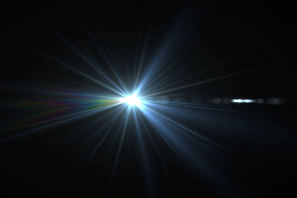 istock Bright beam of a searchlight on a dark background. Light from a lamp in the dark.Flash 1254777819