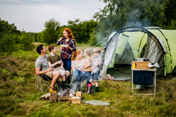 istock Parents interacting with children on springtime camping trip 1254778111