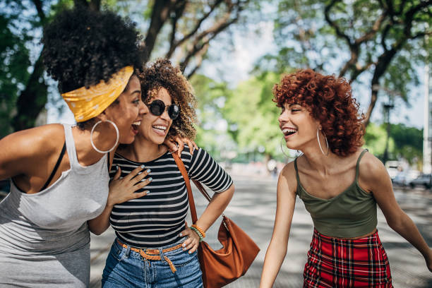 istock Young women walking down the street 1254779252