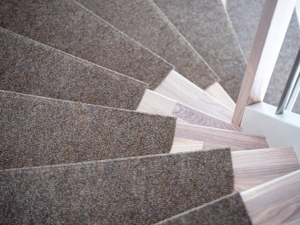 istock Partially Carpeted wooden stairs in a house 1254782483