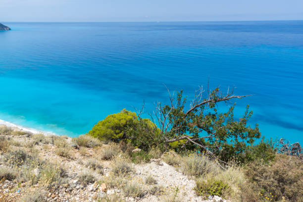 istock Blue waters of Kokkinos Vrachos Beach, Lefkada, Greece 1254783417