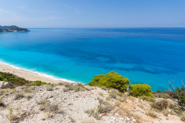 istock Blue waters of Kokkinos Vrachos Beach, Lefkada, Greece 1254783891