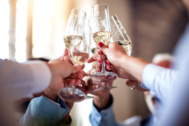 Teamwork concept. Close up image of business people toasting with champagne. toasted stock pictures, royalty-free photos & images