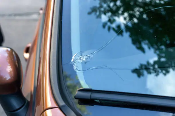 Photo of Broken car windshield glass from stone