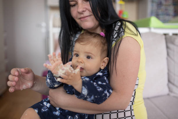 istock Mother and daughter playing with dough 1254785207