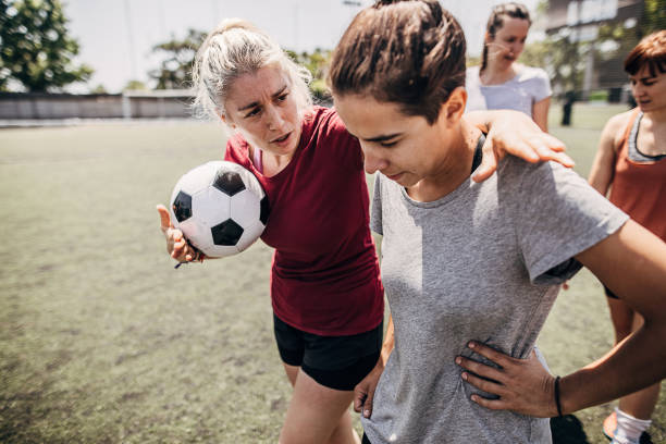 istock Women standing on soccer field 1254785494