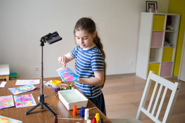 istock children draw paint on water at home. craft ebru. creative art for kids. 1254786678
