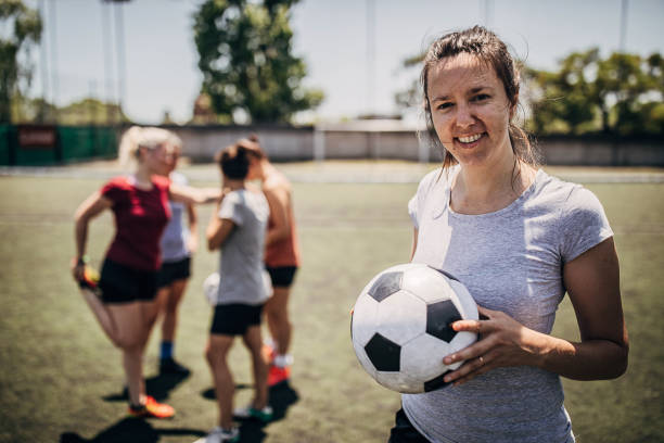 istock Woman standing outdoors on soccer field 1254786688
