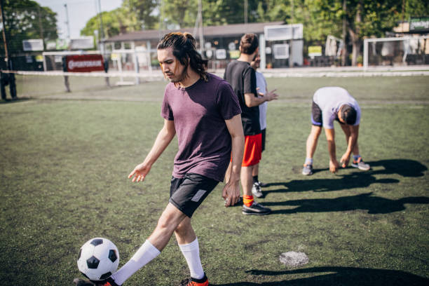 istock Group of men preparing for soccer match 1254789310