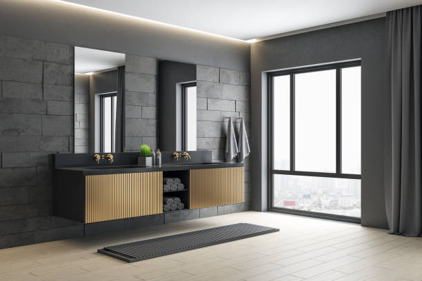 istock Modern gray bathroom with mirror, comfortable bathtub and city view. 1254789498