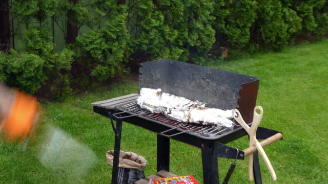 Senior man prepare a barbecue.