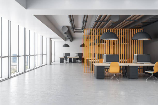 istock Minimalistic coworking office interior with yellow abstract wall 1254790601