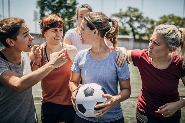 Female soccer players enjoying time together on soccer field Group of women, female soccer players, enjoying time together outdoors on soccer field. football player girlfriend stock pictures, royalty-free photos & images