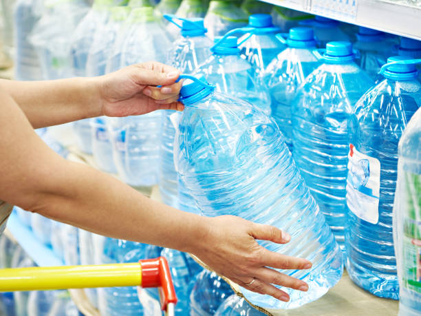 istock Drinking water in hands at shop 1254791314
