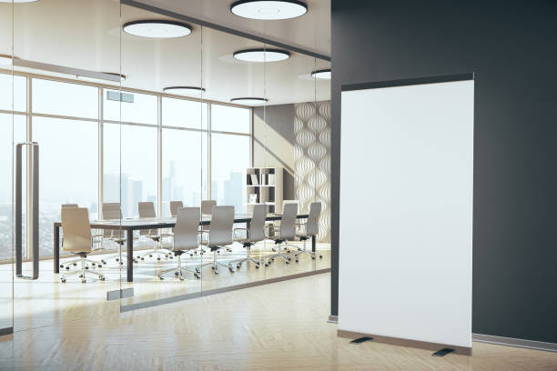 istock Meeting interior with blank vertical billboard 1254791469