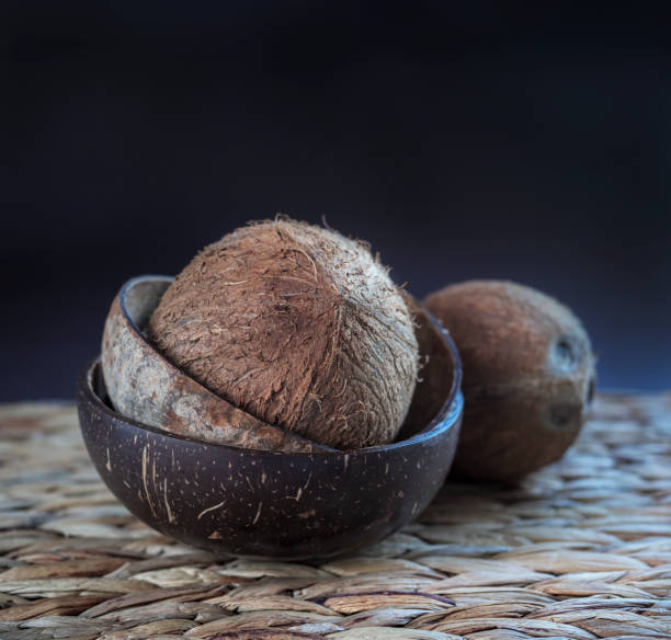 Coconuts into the buddha bowls from the coconut shells, close-up. stock photo