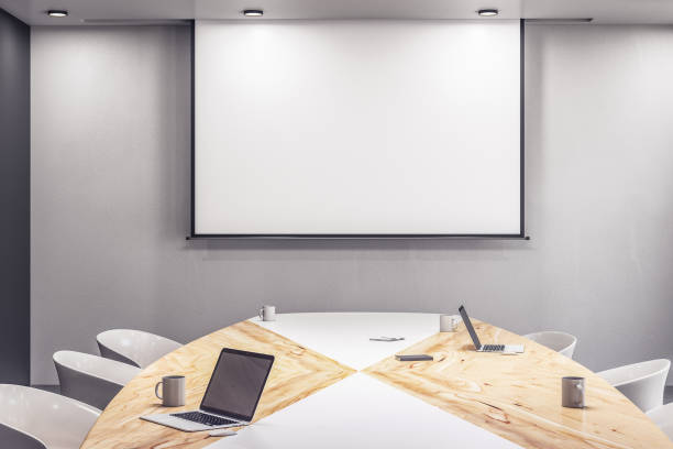 istock Modern meeting room interior with laptop on table 1254794338