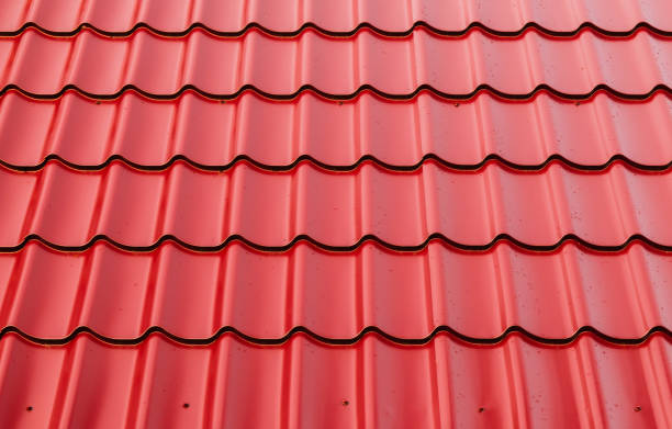 istock New red metal shingles roof texture, background 1254794887