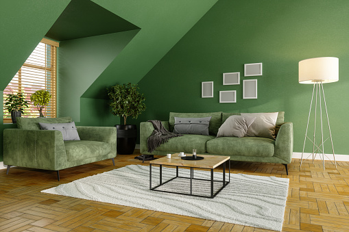 Green Living Room With Green Sofa, Coffee Tables and Plants
