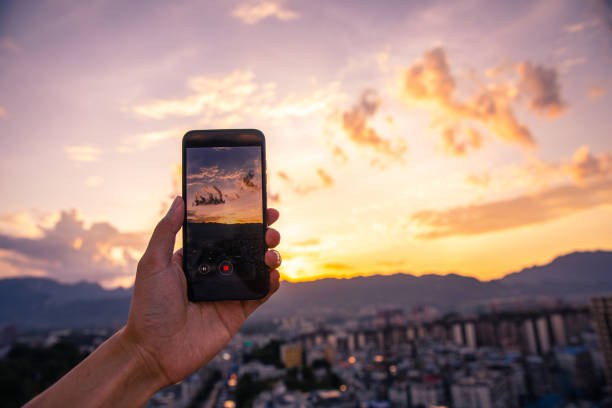 istock Filming city sunset with mobile phone 1254797197