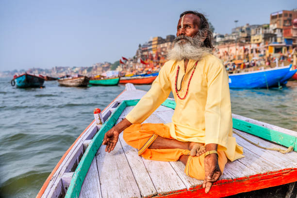 istock Sadhu is meditating in boat on Holy Ganges River, Varanasi 1254797556