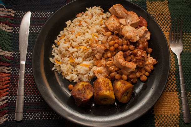 istock Plate with rice, yellow beans, chicken and plantains 1254797664