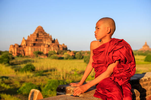 istock Young Buddhist monk looking at the view, Bagan, Myanmar 1254798387