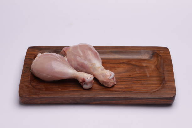 Raw chicken leg pieces stock photo