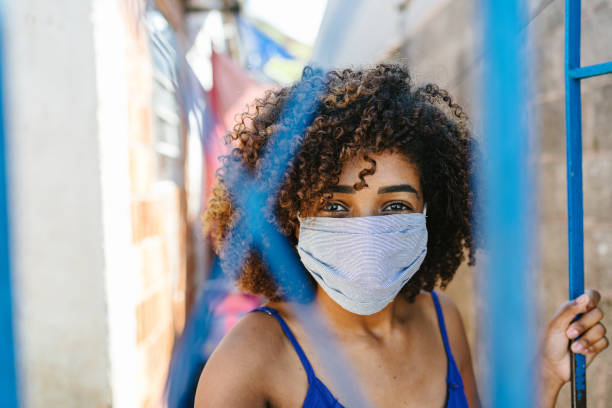 istock Girl wearing protective mask at home yard 1254800334