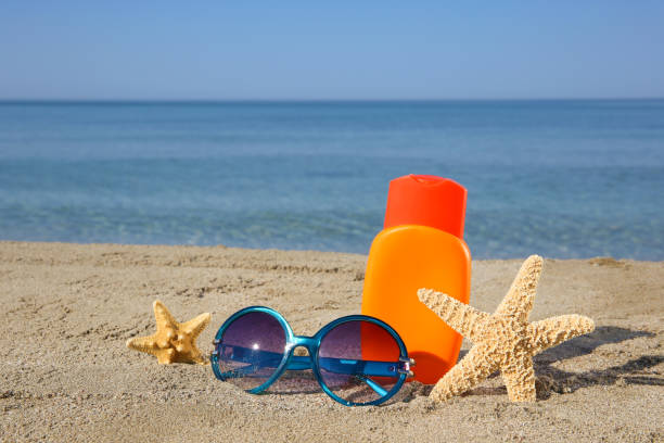 Summer women's accessories on beach.