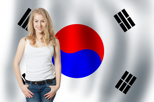 The Republic of Korea concept. Travel in South Korea. Cute Girl wirh flag