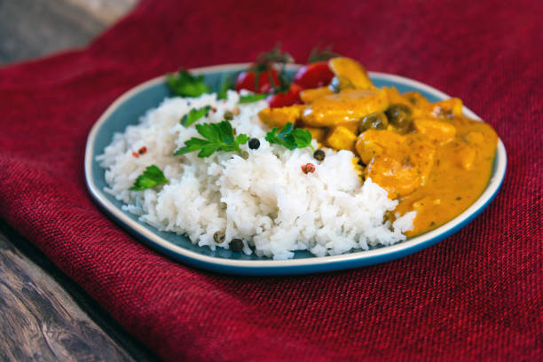 istock chicken tikka masala and rice basmati 1254802965