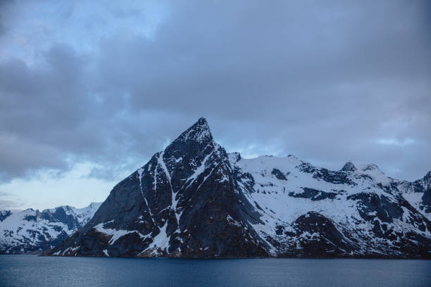 istock Snowcapped mountain in Lofoten, Norway. 1254803261